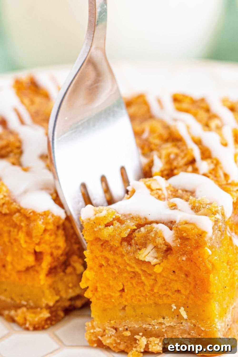 Sweet Autumn Pumpkin Crumble Bars 18 Pumpkin streusel with bite being taken out with a fork