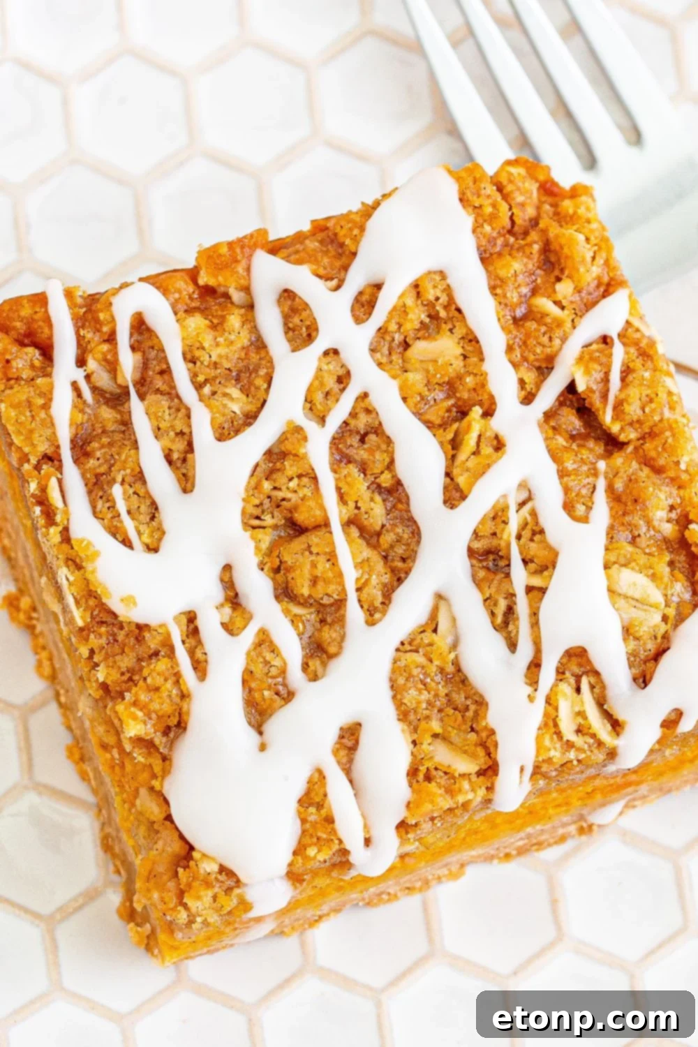 Sweet Autumn Pumpkin Crumble Bars 19 Pumpkin crumble bar on plate with fork