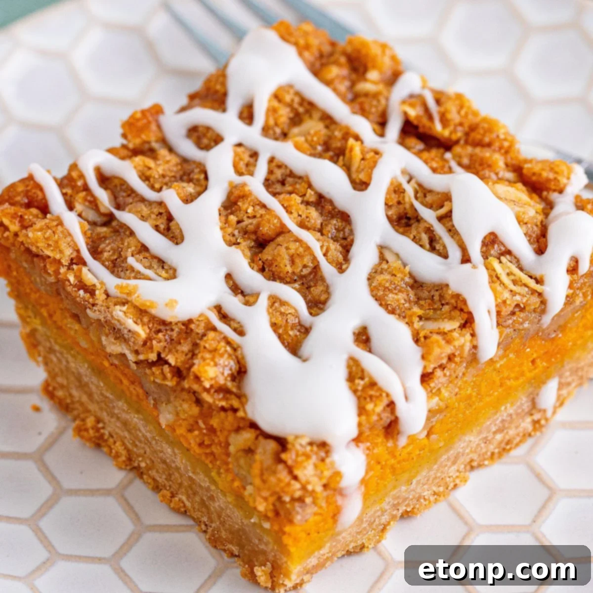 Sweet Autumn Pumpkin Crumble Bars 3 Pumpkin Streusel Bar sliced on a white plate