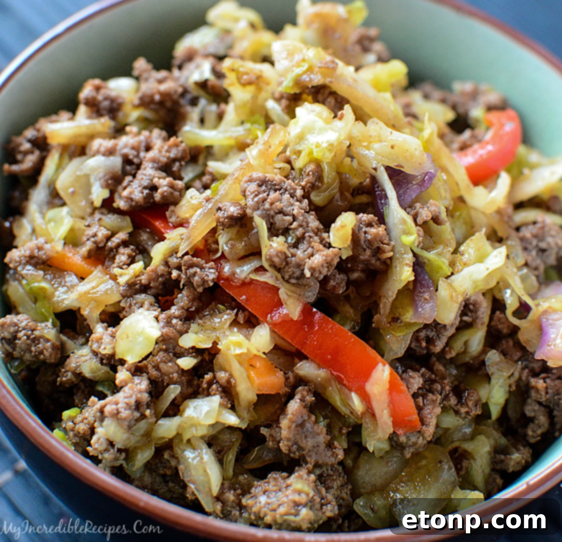Close-up of the textured, flavorful beef and cabbage dish