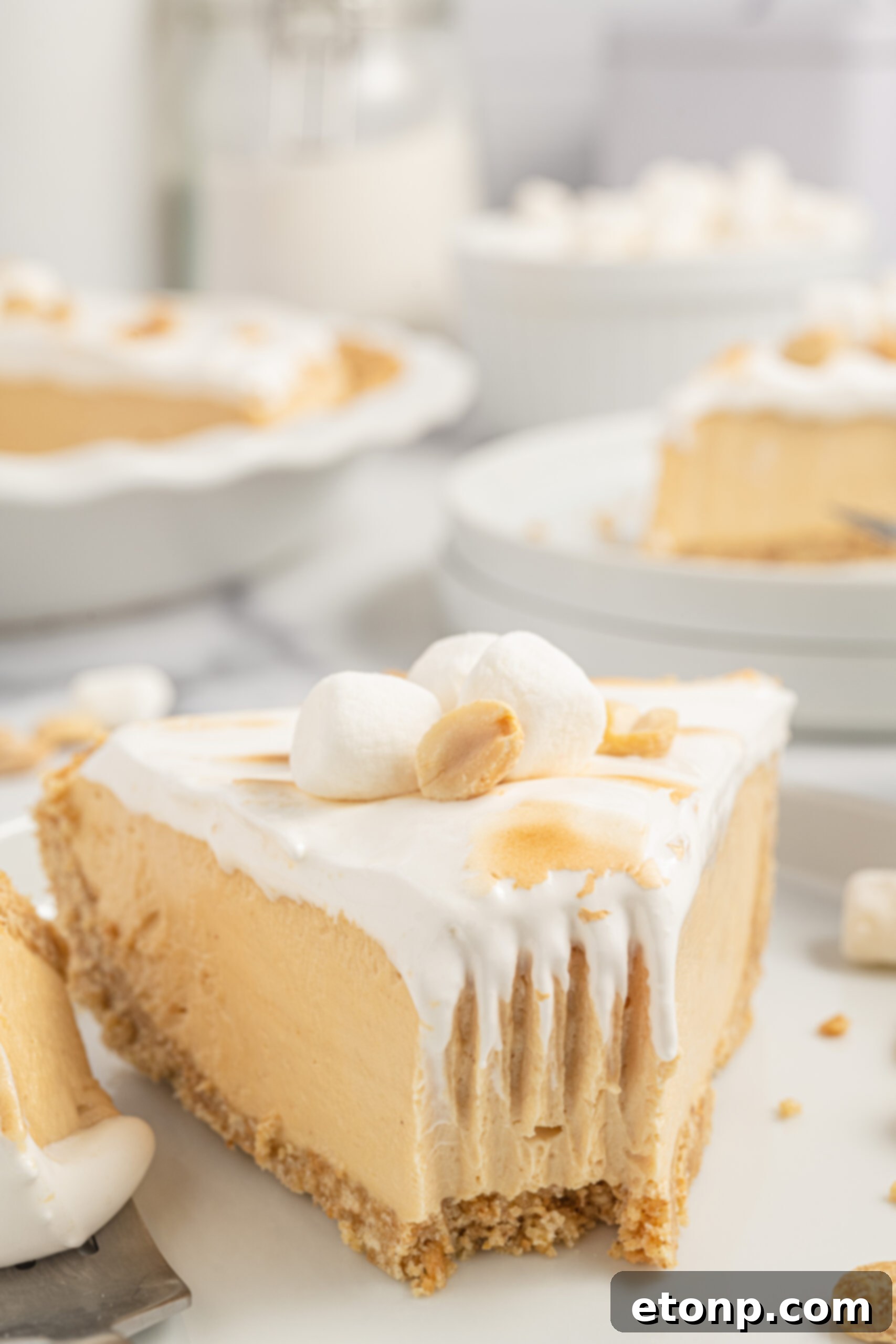 Up close shot of a Fluffernutter Pie slice with a bite taken out, showing texture