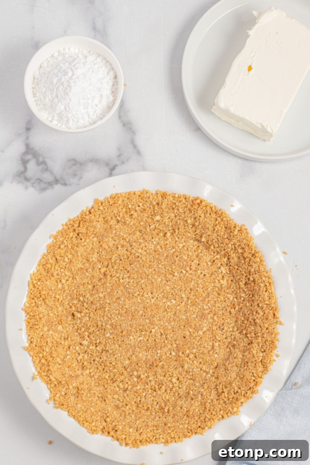 Graham cracker crust pressed into a pie pan