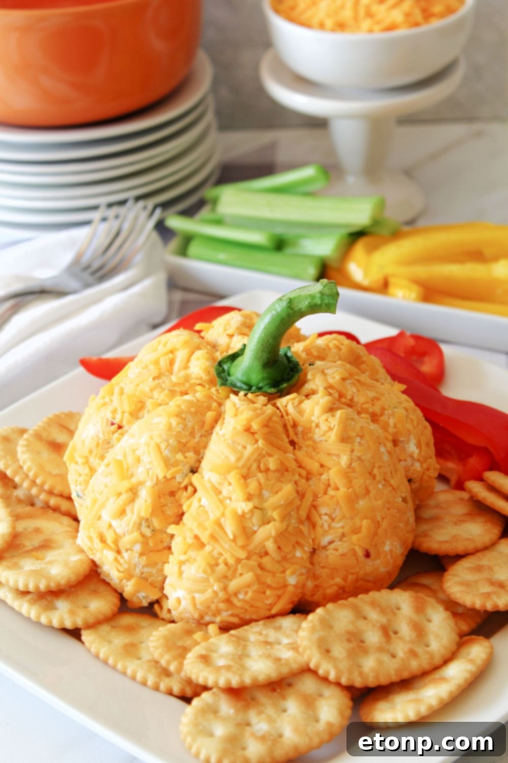 fall cheese ball on platter with dippers around it