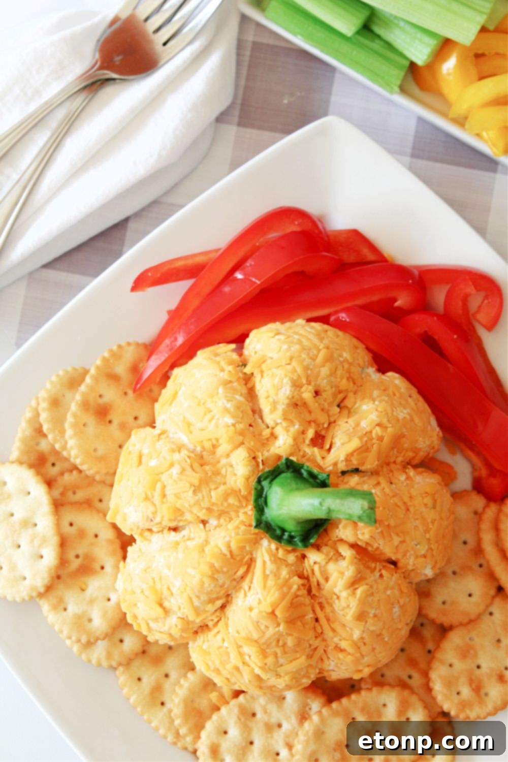 overhead shot of pumpkin cheeseball on plate