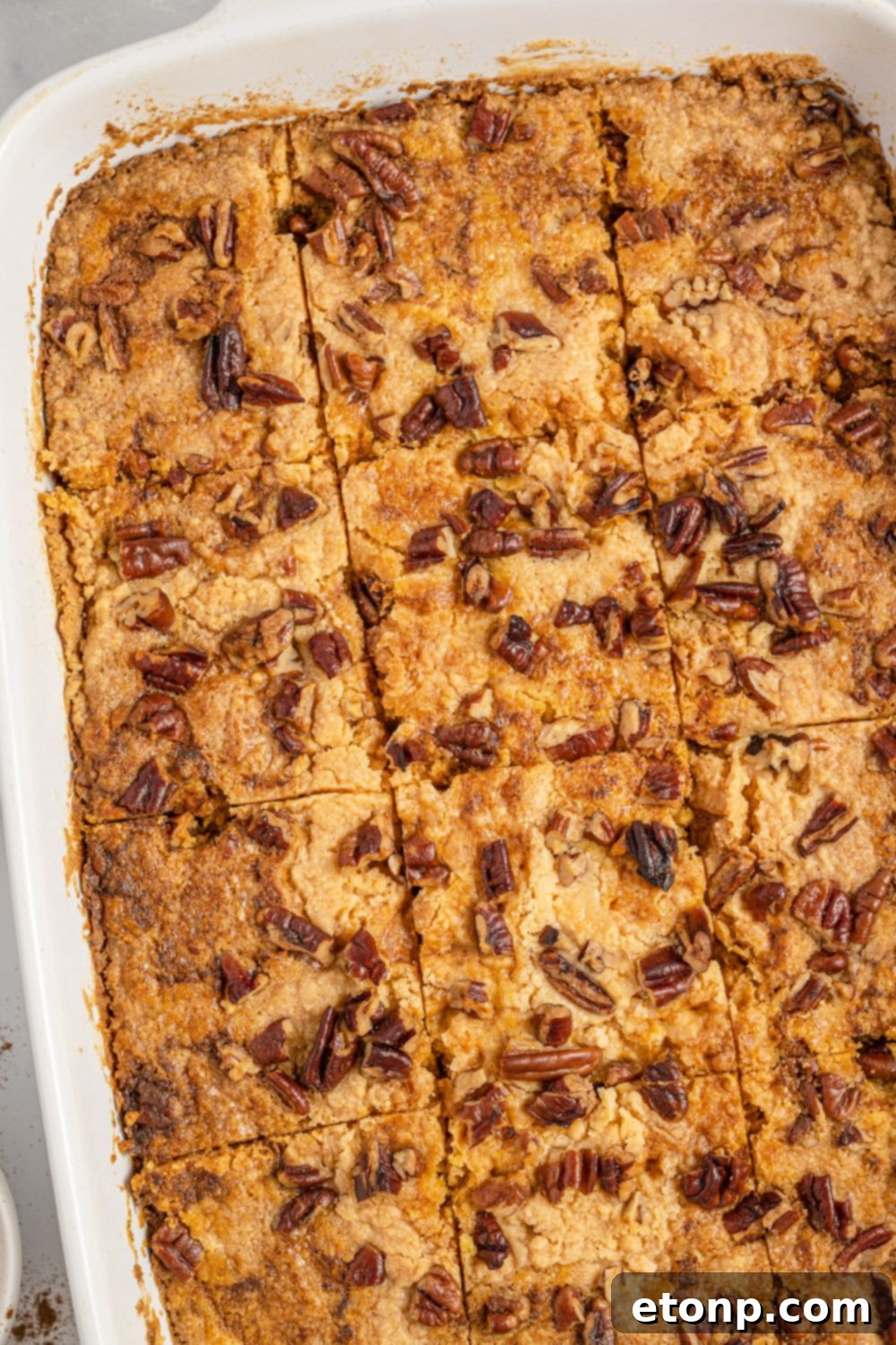 Pumpkin Streusel Cobbler 15 overhead view of cake in pan with slices made