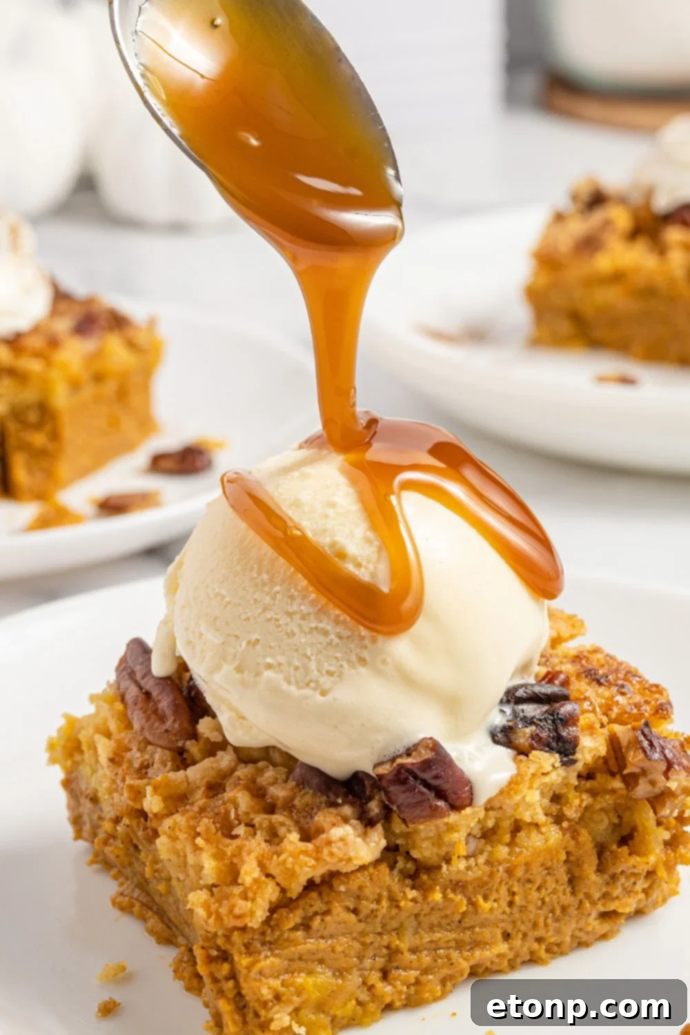 Pumpkin Streusel Cobbler 19 drizzling caramel on top of dump cake