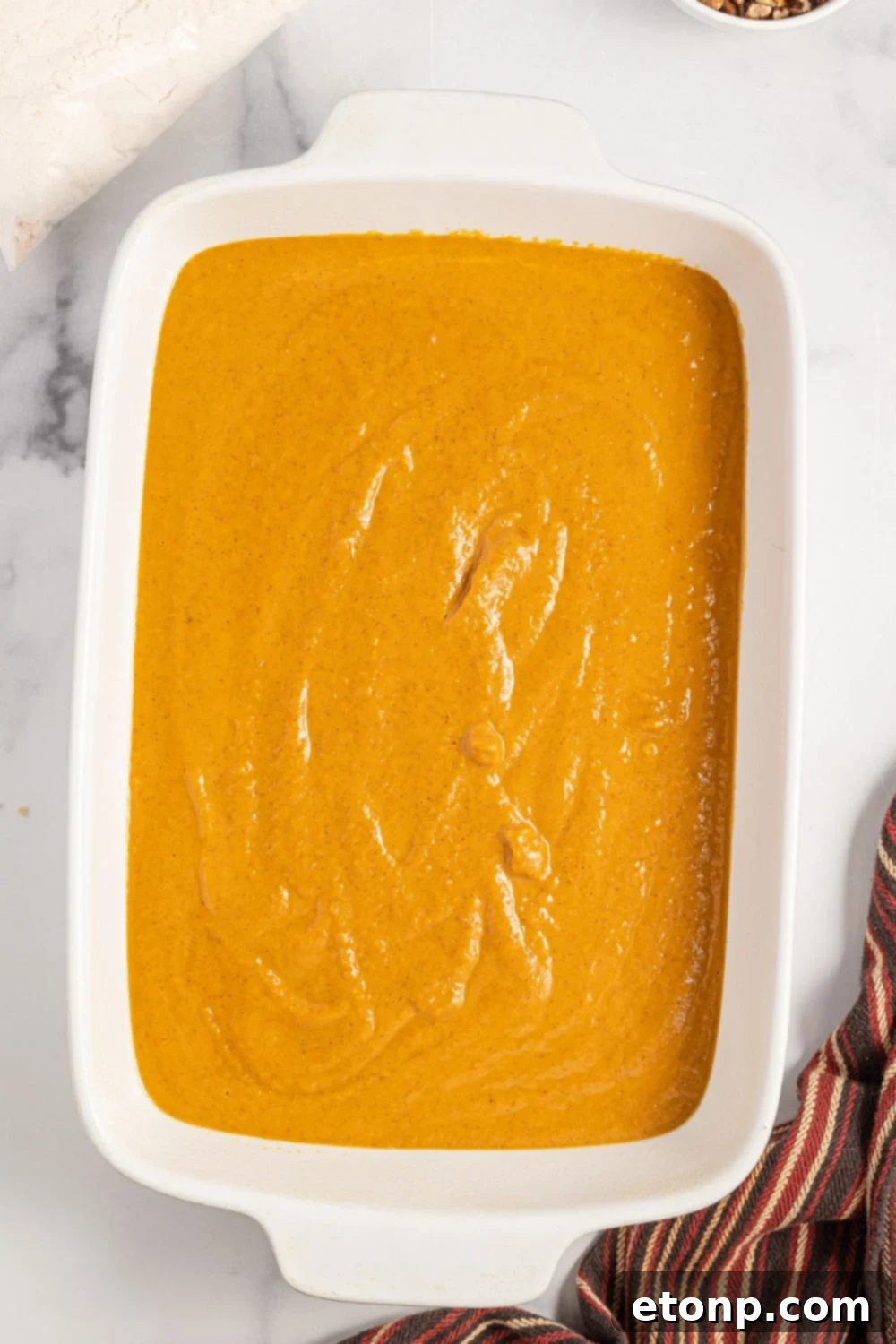 Pumpkin Streusel Cobbler 10 raw pumpkin cake batter in a baking dish