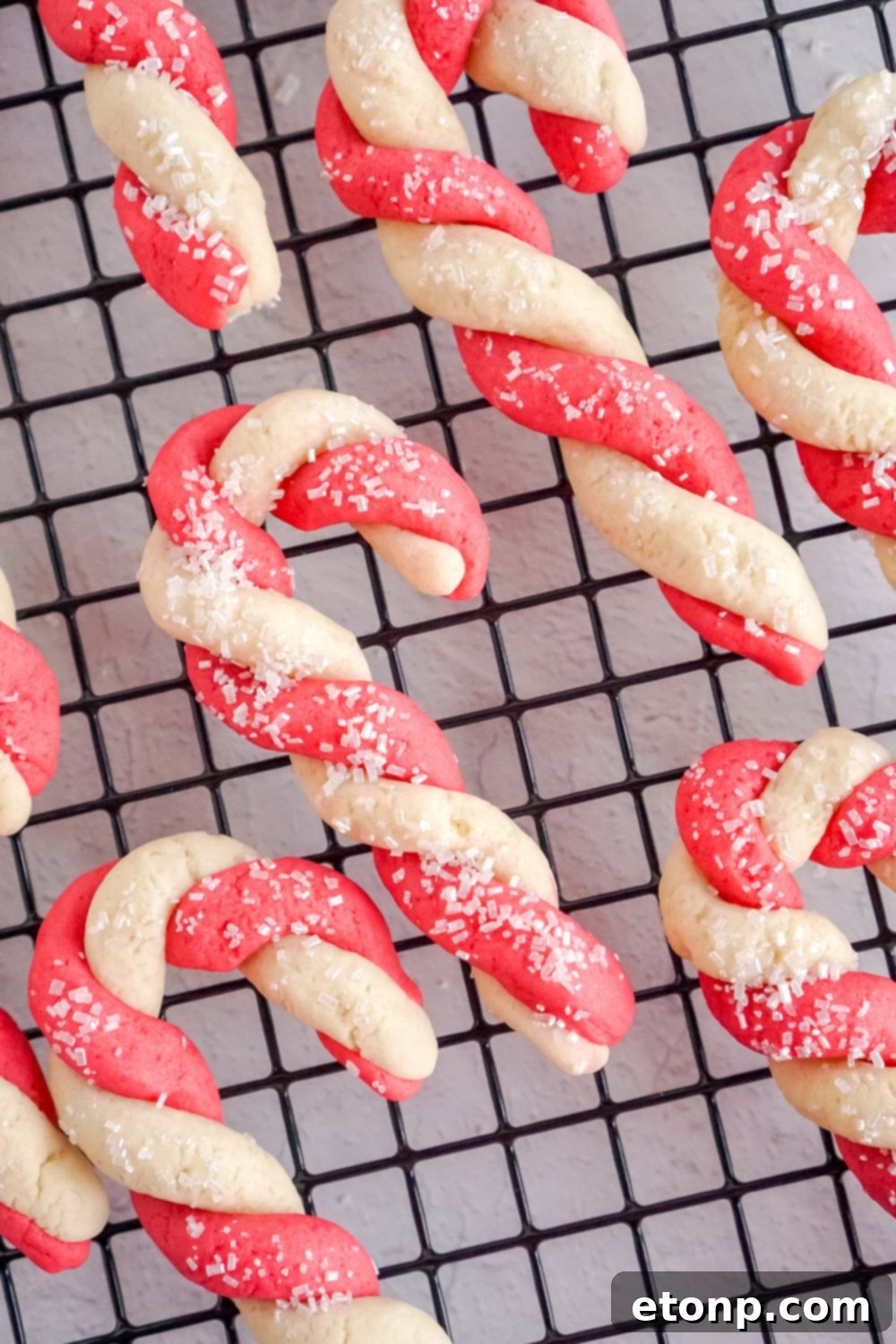 Sweet Peppermint Swirls 23 Candy cane cookies cooling on a wire rack