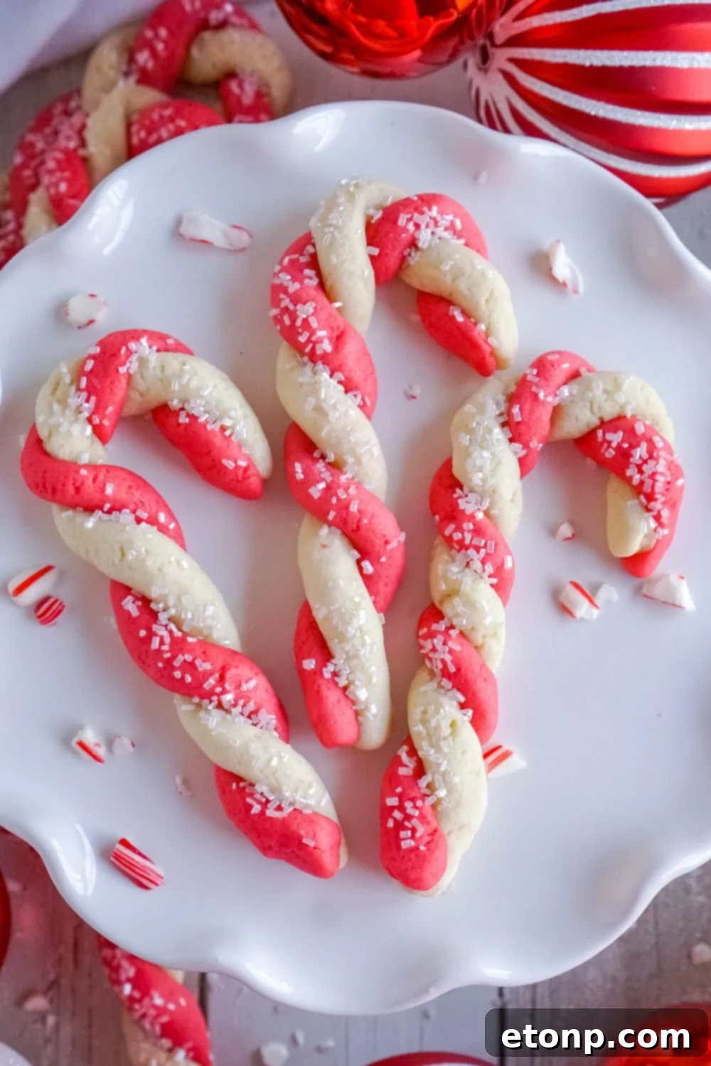 Sweet Peppermint Swirls 25 Easy candy cane cookies on a white plate, showcasing their delightful swirl