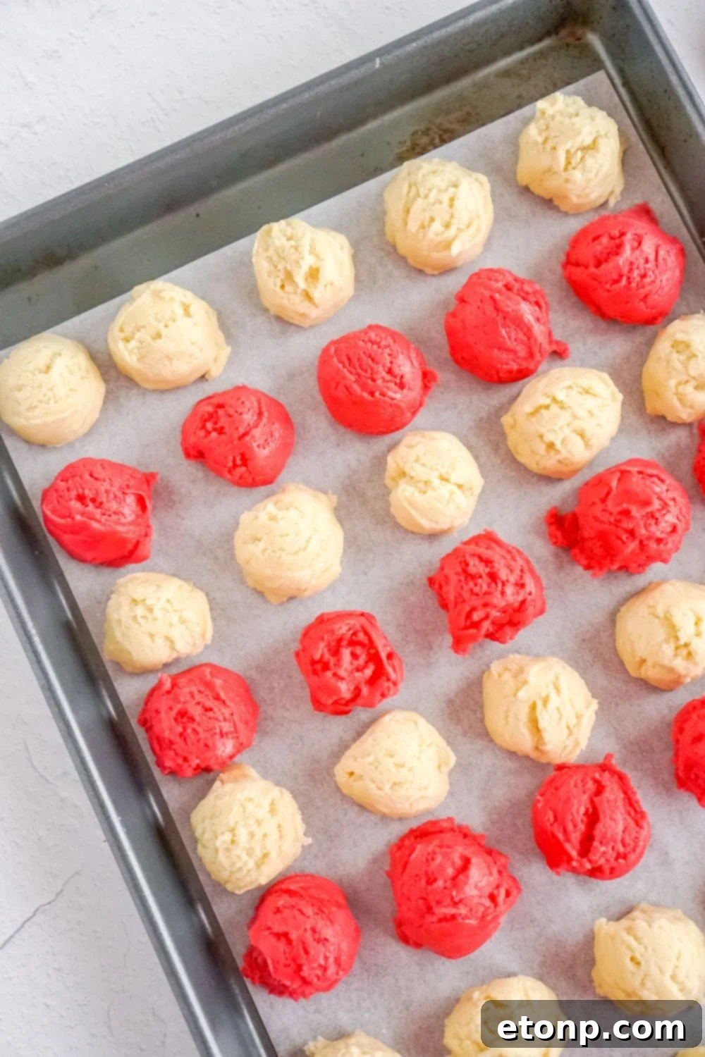 Sweet Peppermint Swirls 9 Balls of cookie dough on a baking tray before chilling