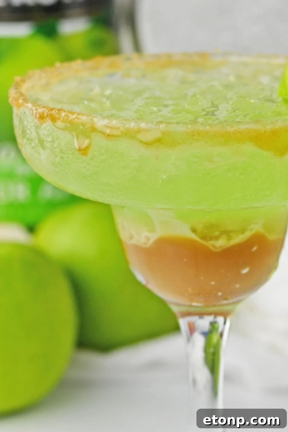 close up view of caramel apple cocktail in glass
