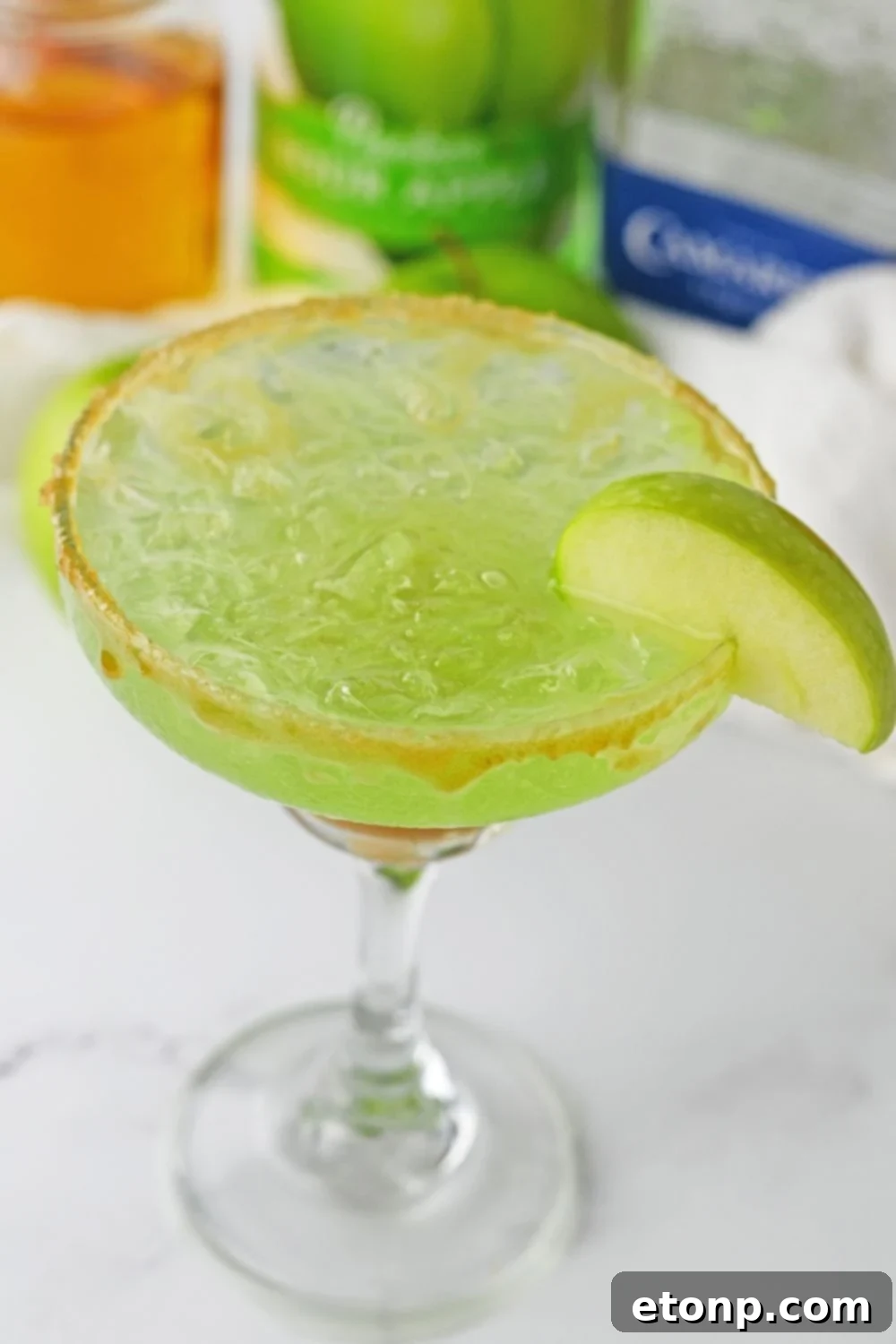 caramel apple margarita on table with overhead shot of glass
