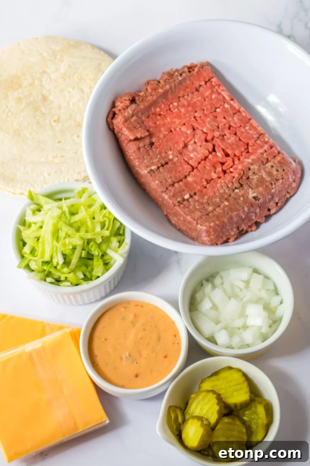Ingredients for Big Mac smash tacos laid out on a table