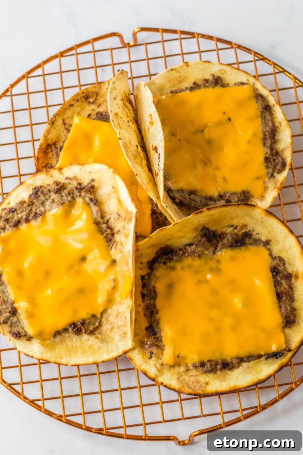 Smash taco burgers with cheese melting on top
