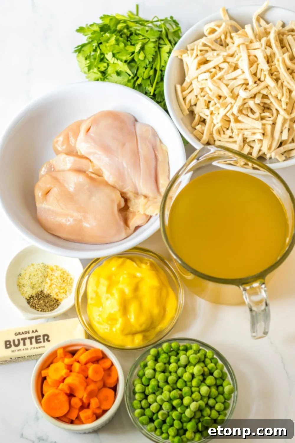 ingredients for chicken noodle soup on table