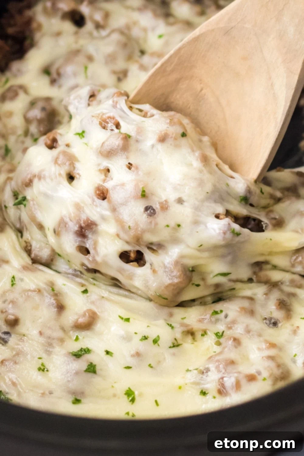 ground beef mixture with cheese in slow cooker