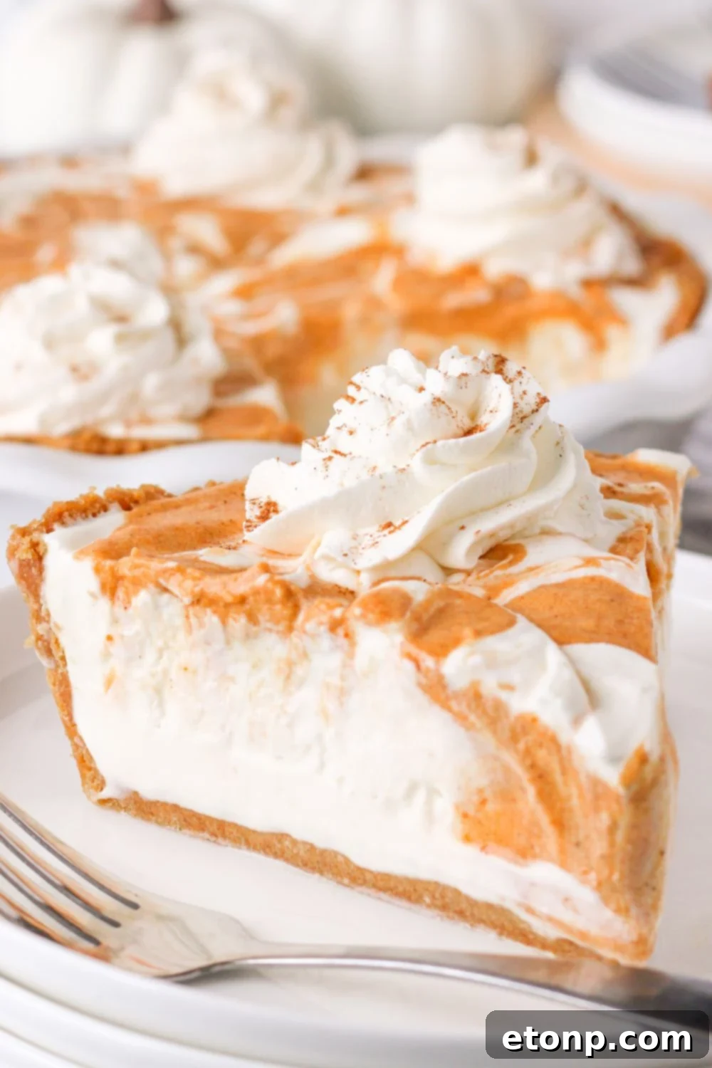 A perfectly portioned slice of pie artfully arranged on a plate with a fork nearby, poised for a delightful taste.