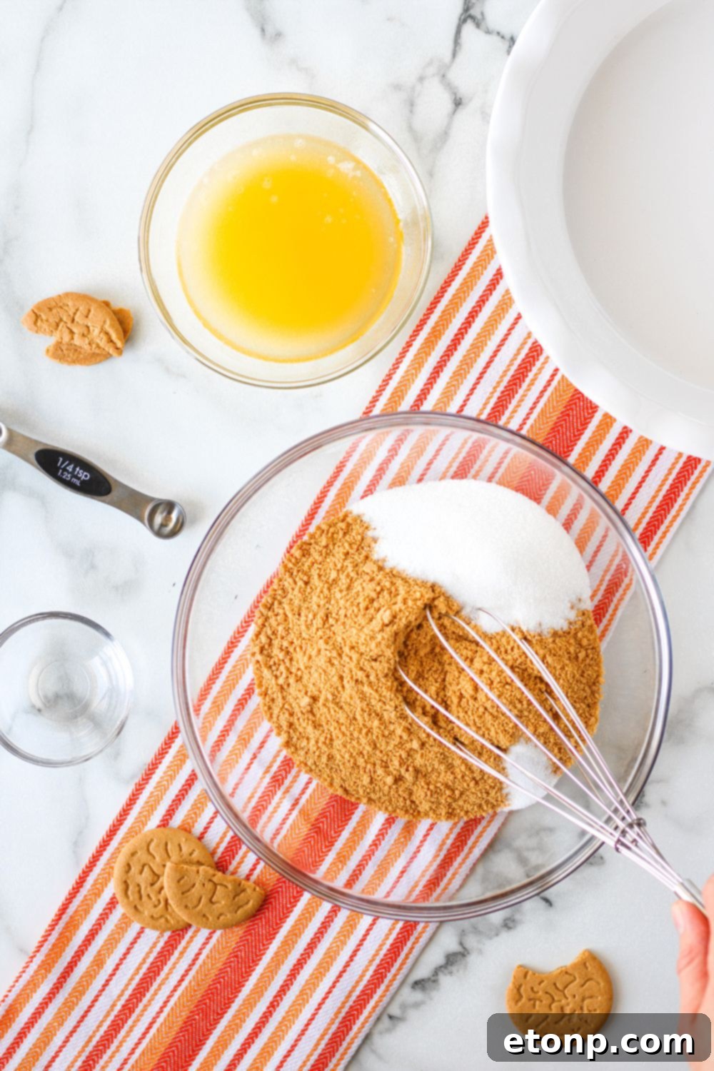A freshly prepared gingersnap based crust, pressed firmly into a pie dish, ready for its creamy filling.