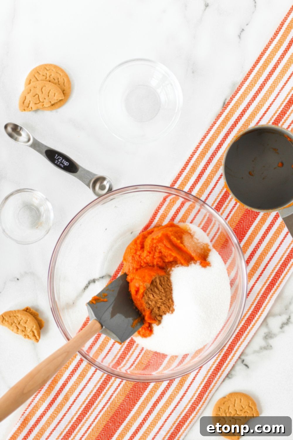 A vibrant bowl of smooth pumpkin puree, showcasing its rich color and readiness to be transformed into a delicious pie filling.