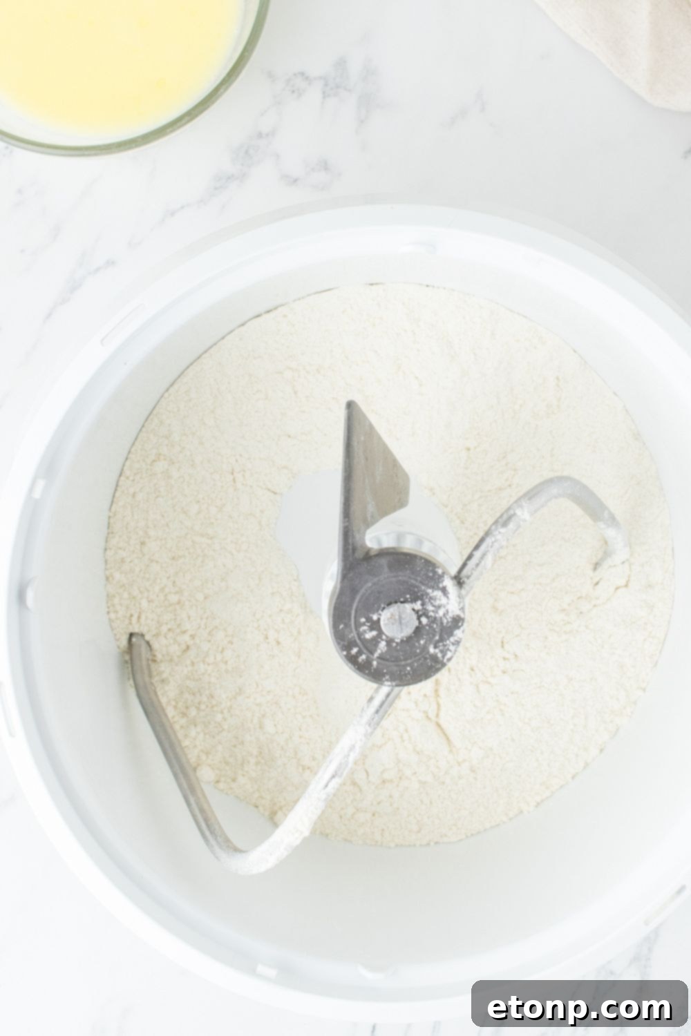Dry ingredients being mixed in a stand mixer