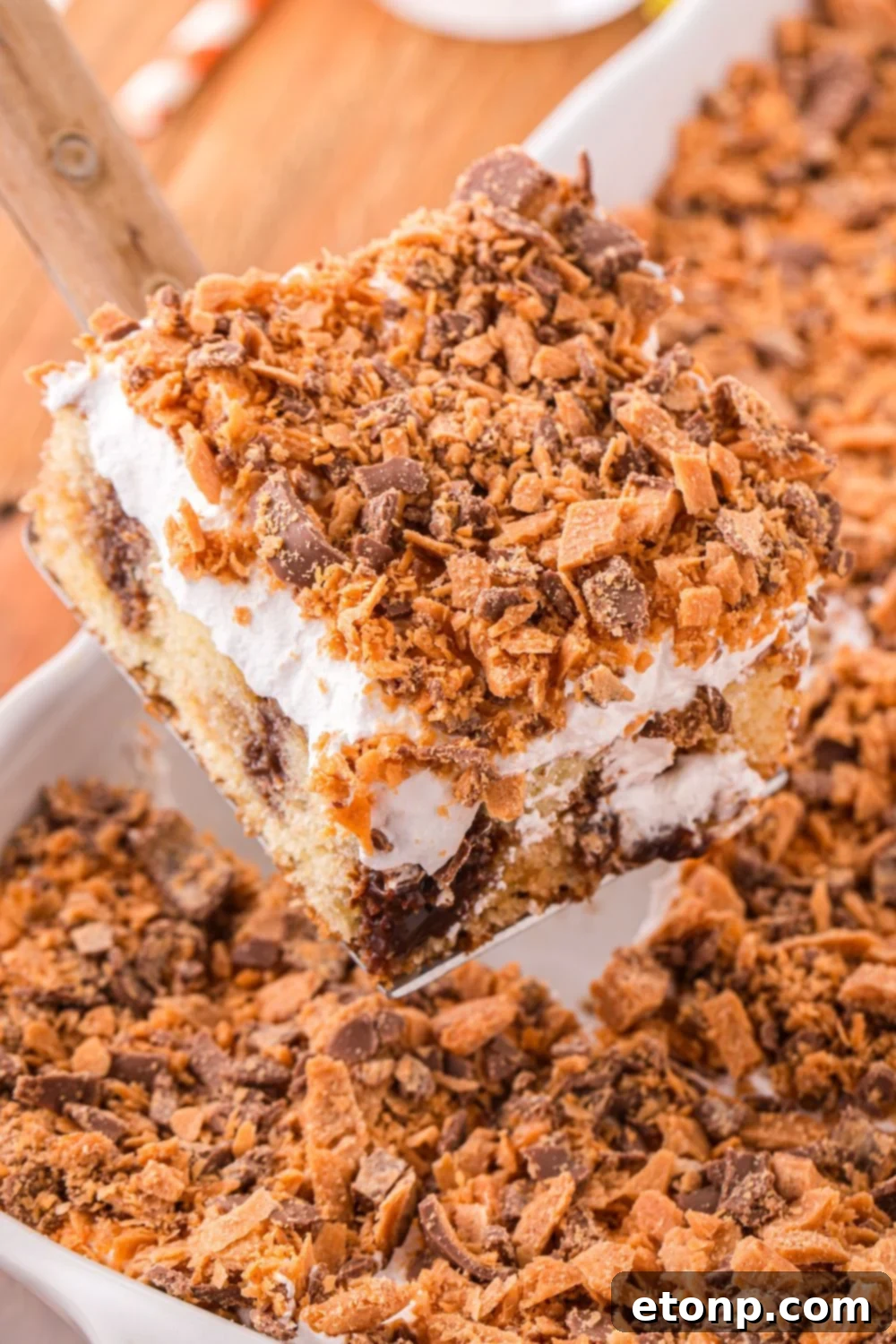 slice of cake on spatula above pan
