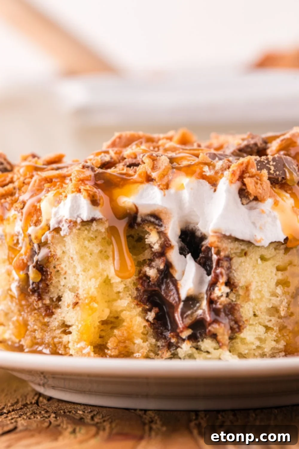 slice of cake on plate with a bite taken out