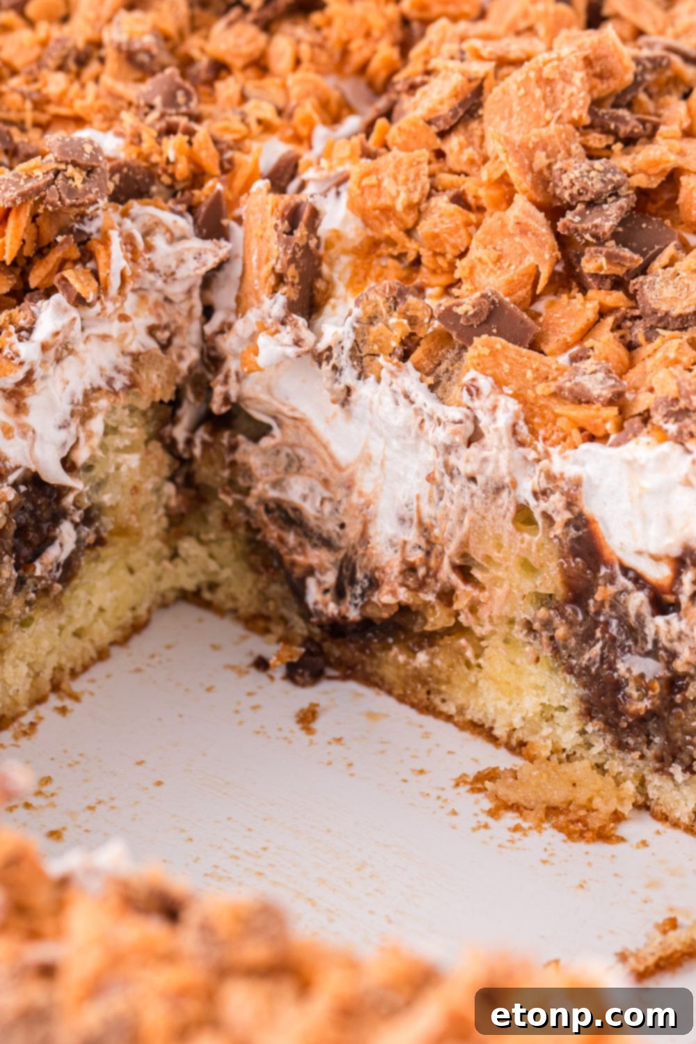 butterfinger delight in pan with a few slices removed