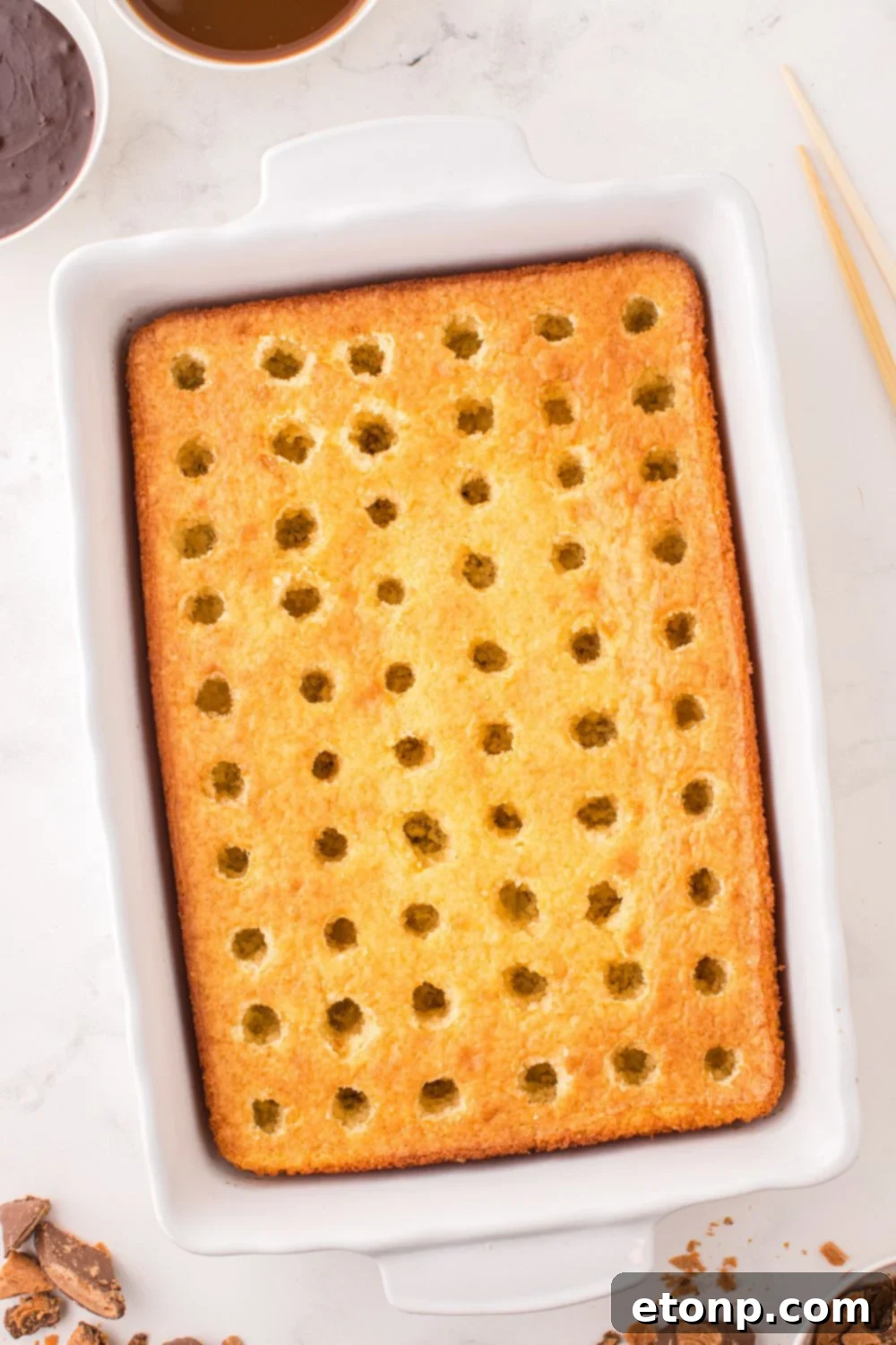 holes poked all over cake 