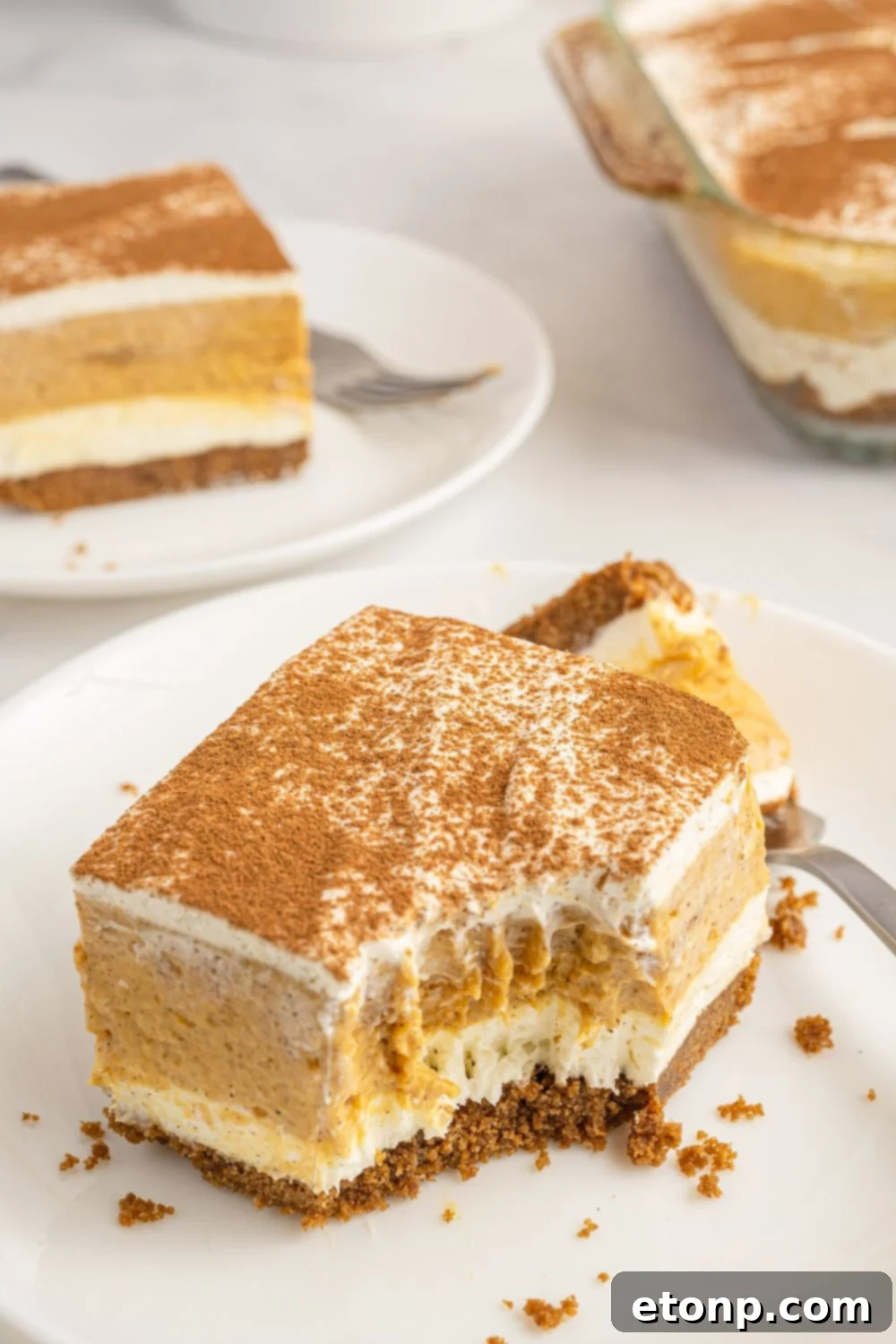 pumpkin pudding delight on plate with fork taken out of it