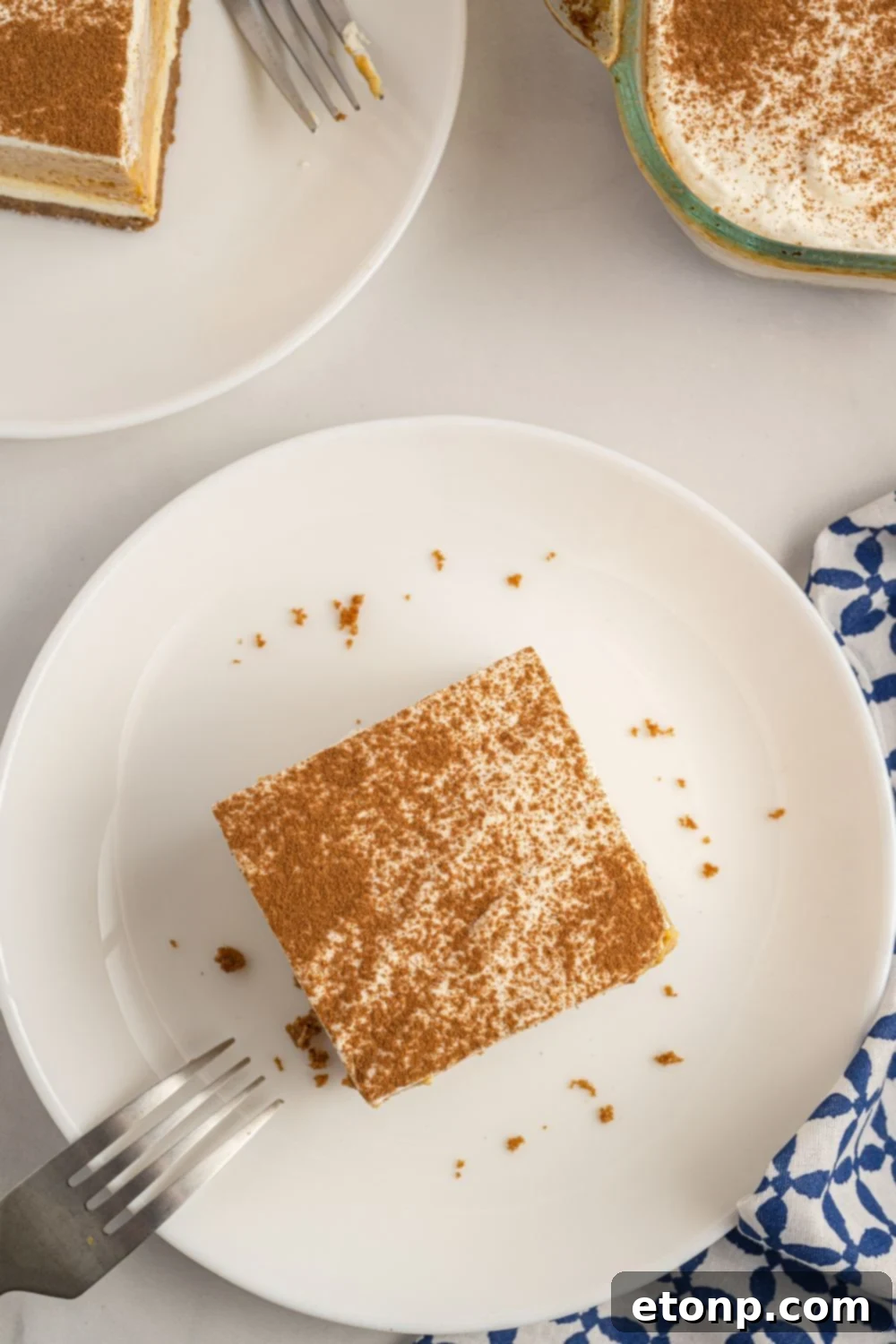 slice of pumpkin dessert on plate with fork on side