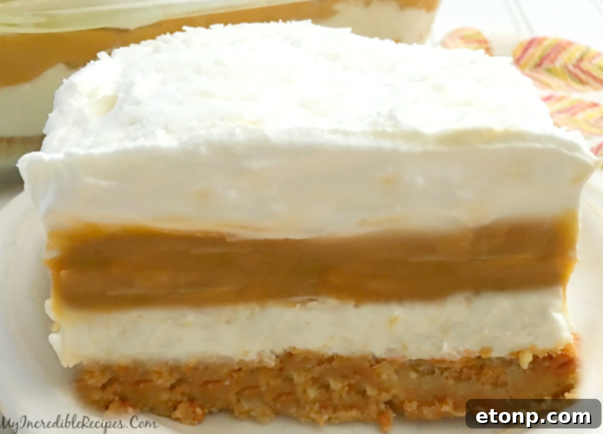 Delicious layers of no-bake pumpkin cheesecake lasagna, ready to be served.