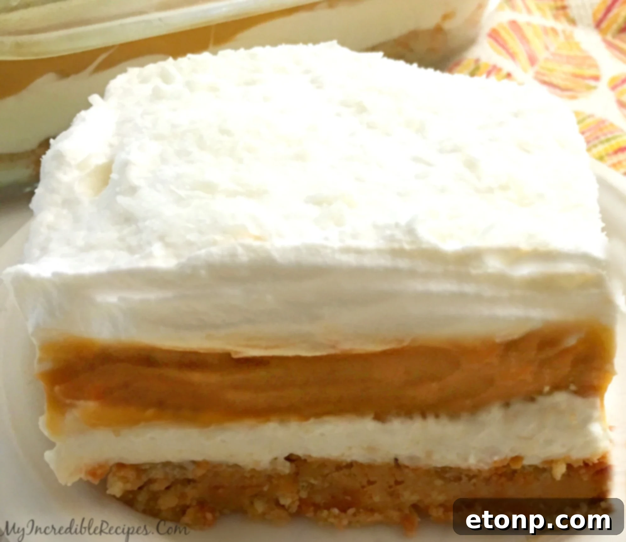 Overhead shot of the entire pumpkin cheesecake lasagna dessert, ready to be sliced.