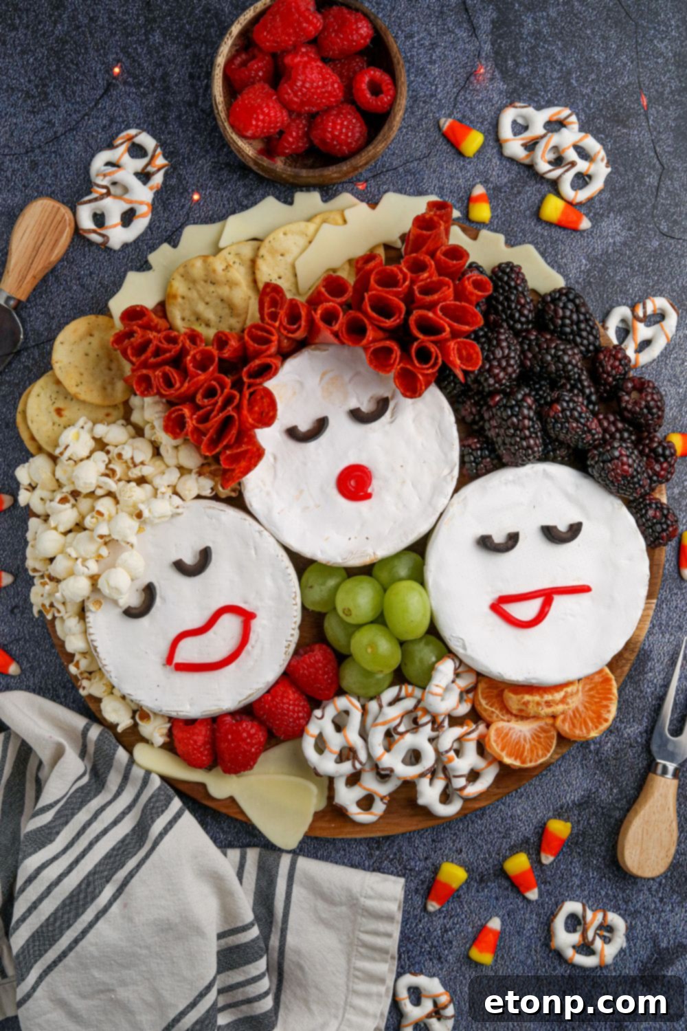 overhead shot of charcuterie board on table that looks like sanderson sisters