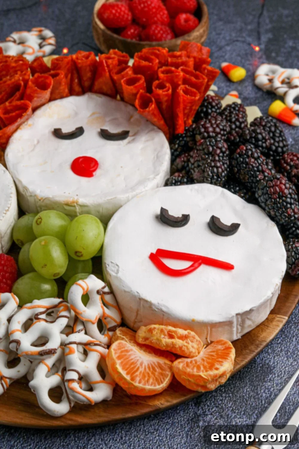 hocus pocus tray with oranges, grapes, and more around it