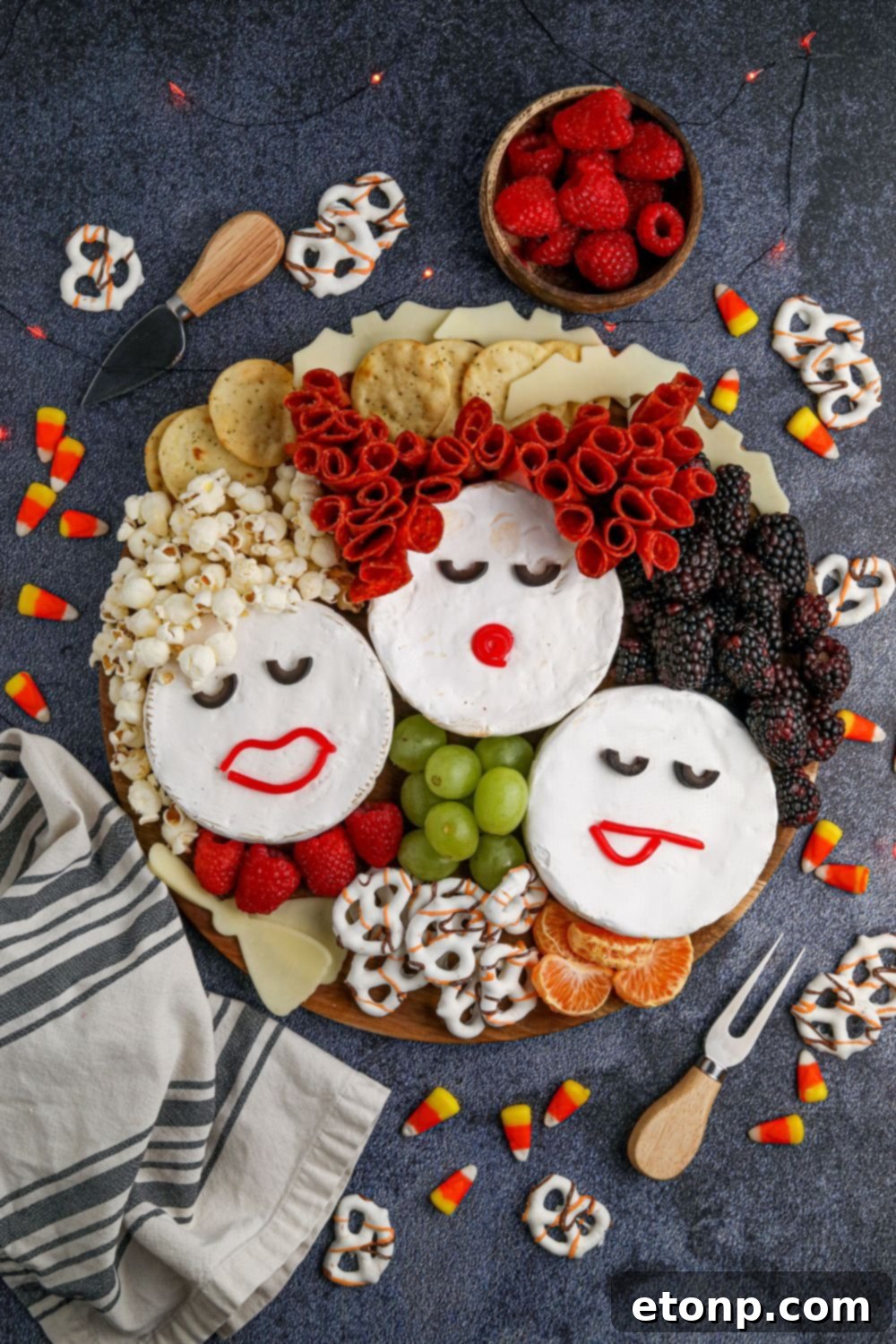 hocus pocus treat snack board on table with snacks all around it