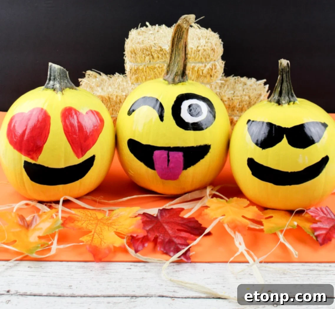 A beautifully decorated home entrance for Fall with various sized pumpkins, hay bales, and corn stalks, creating a welcoming autumn atmosphere.