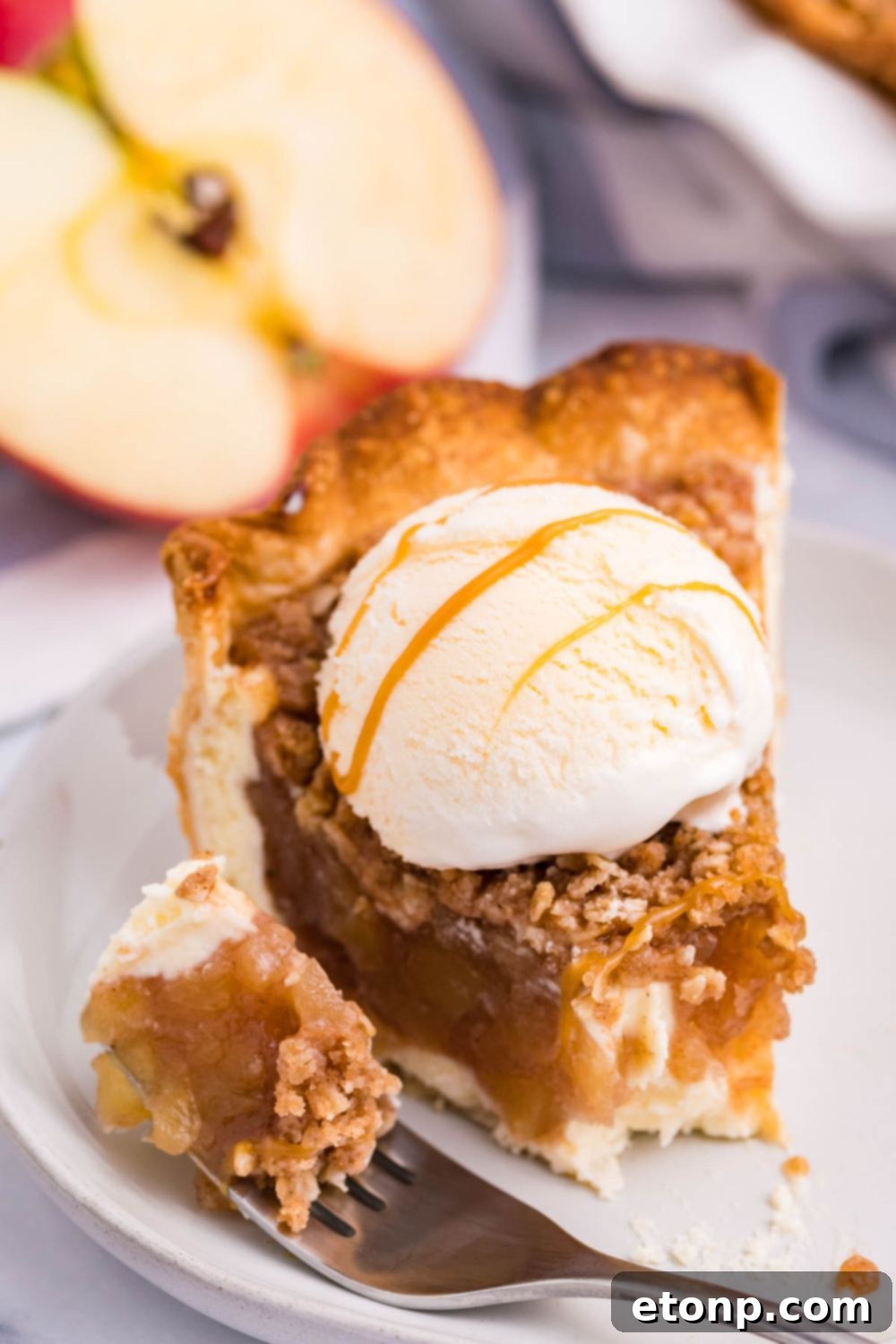 apple crumble cheesecake with bite on a fork