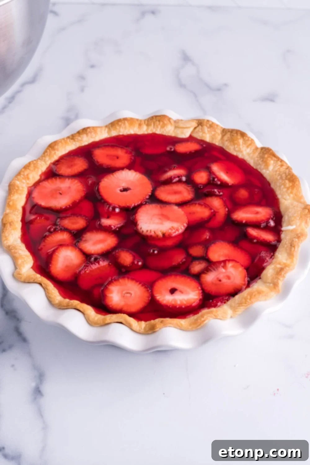 jello mixture poured on top of the pie