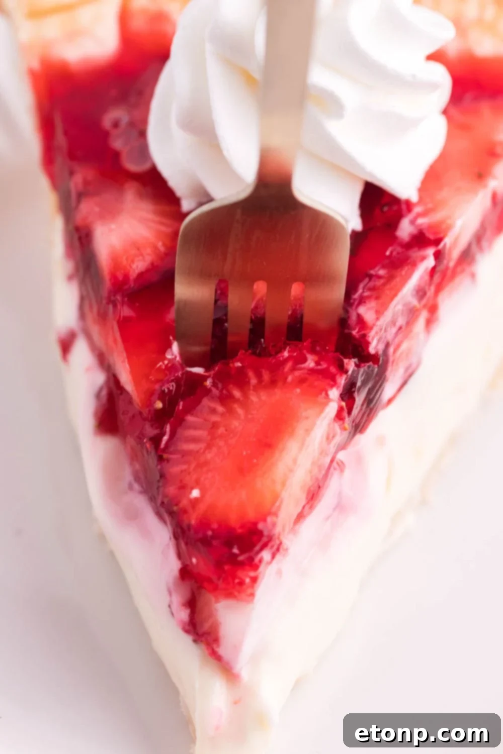 fork going into slice of pie