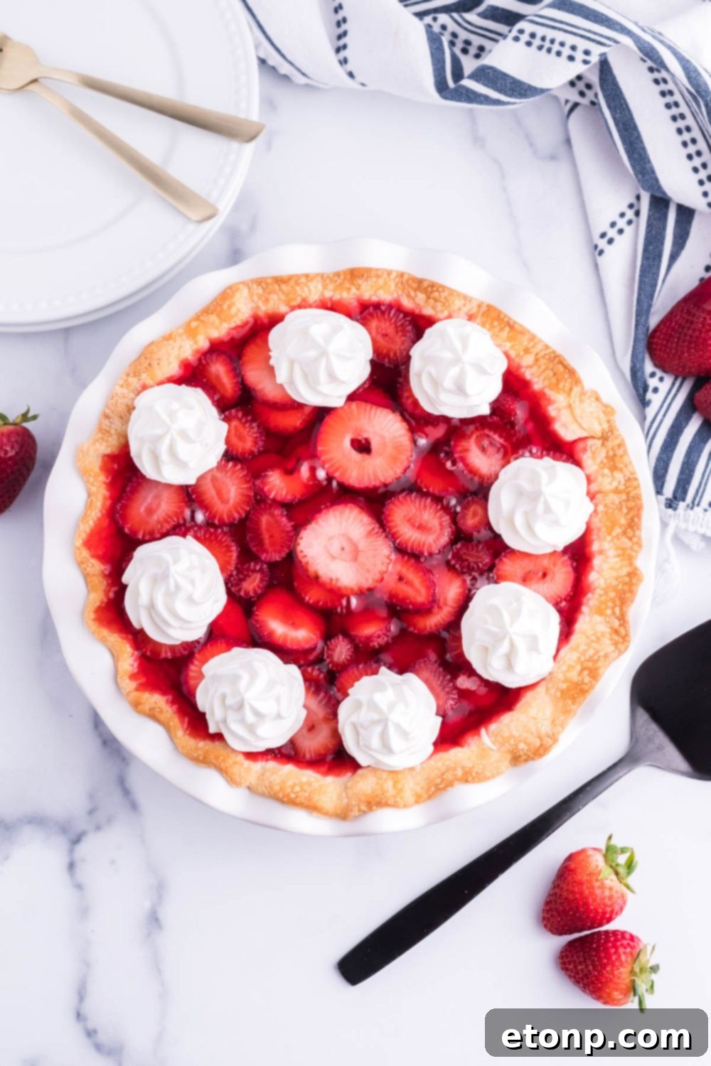 strawberry cheesecake pie on plate with overhead look