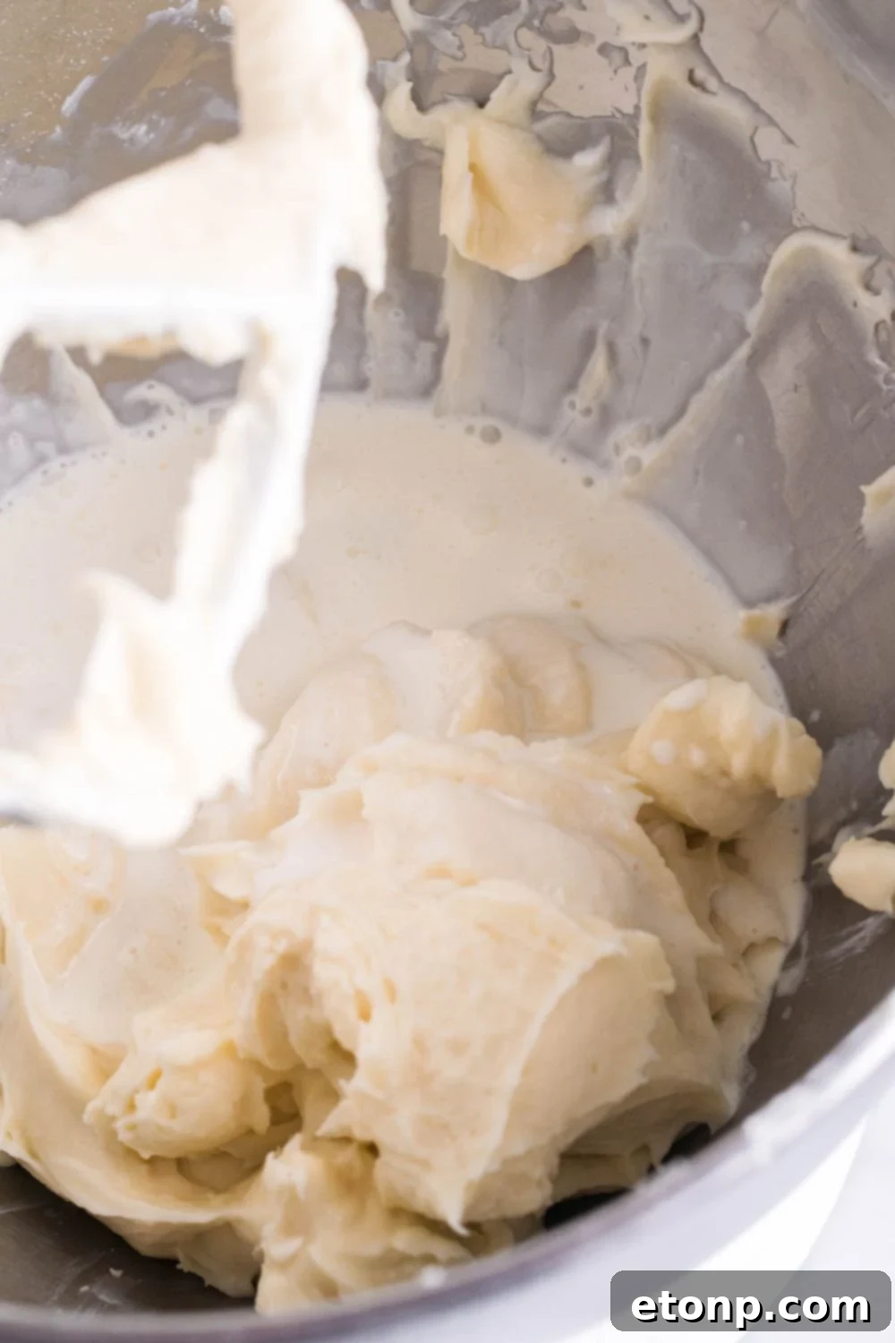 mixing up the cream cheese mixture of the pie 