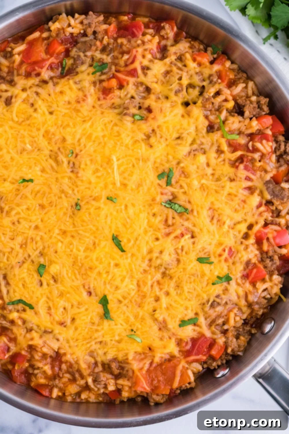 Stuffed Pepper Casserole in pan with cheese on top 
