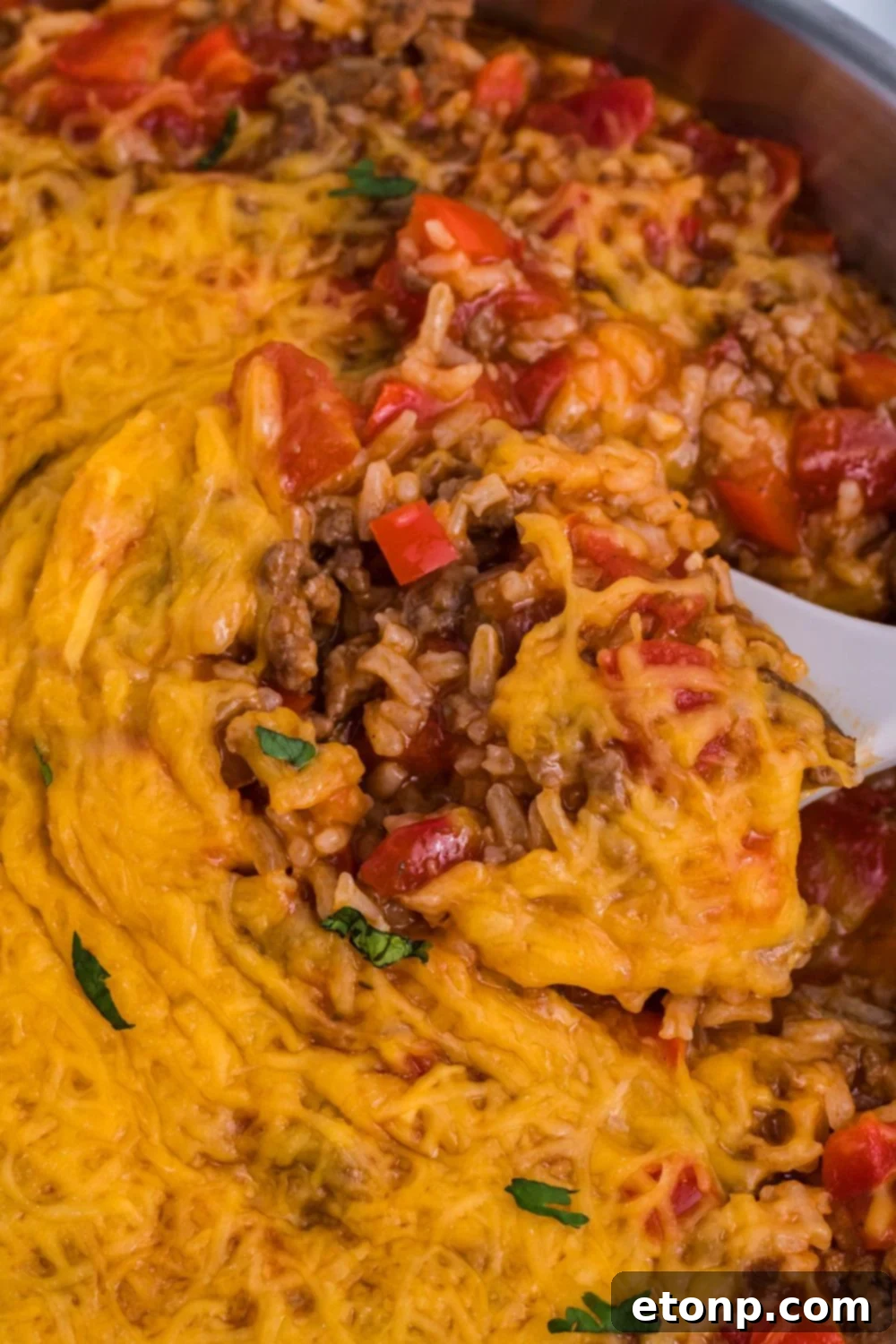 Stuffed Pepper Casserole in pan with a spoon scooping some up 