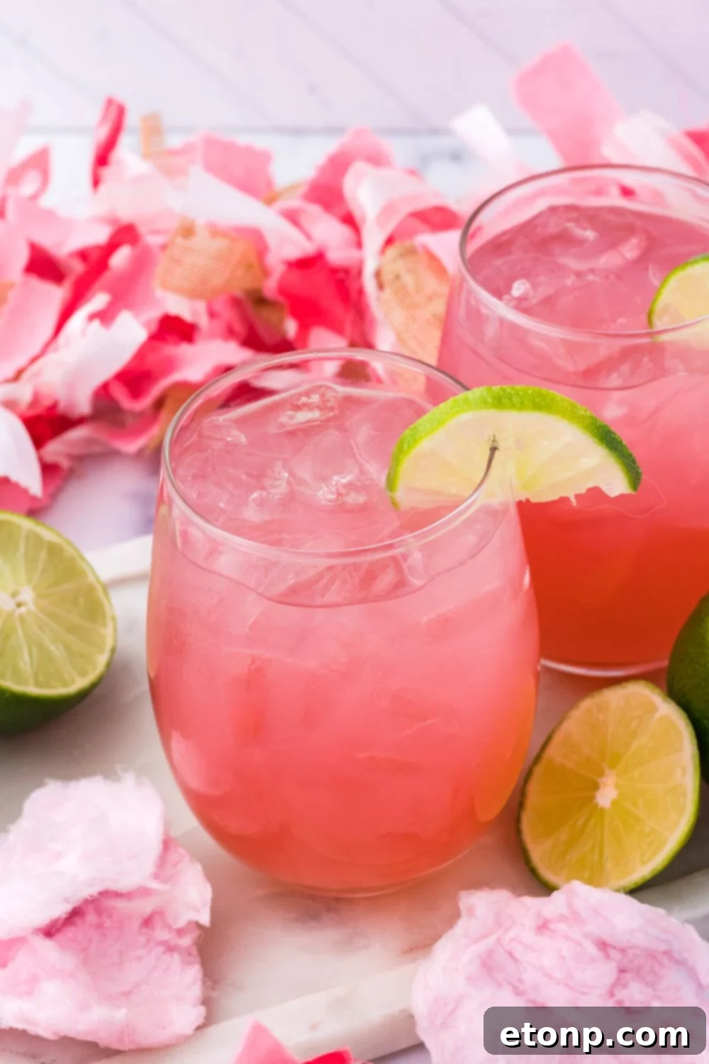 glasses with a sweet cocktail on top of it 