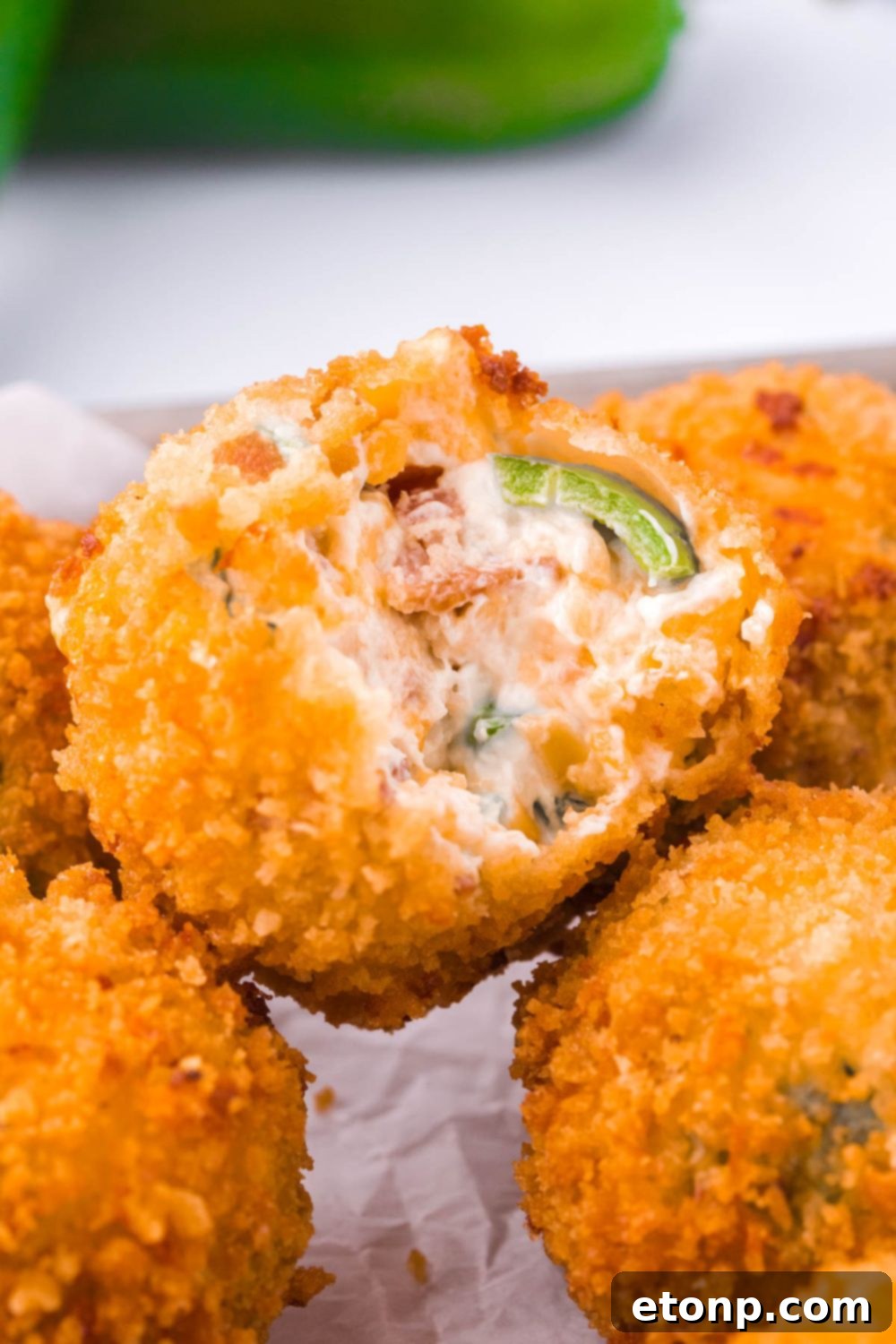 Crispy Jalapeno Cream Bombs 7 Jalapeno Popper Bite with a bite taken out
