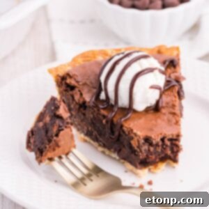 Brownie Pie on plate with a fork with bite on side