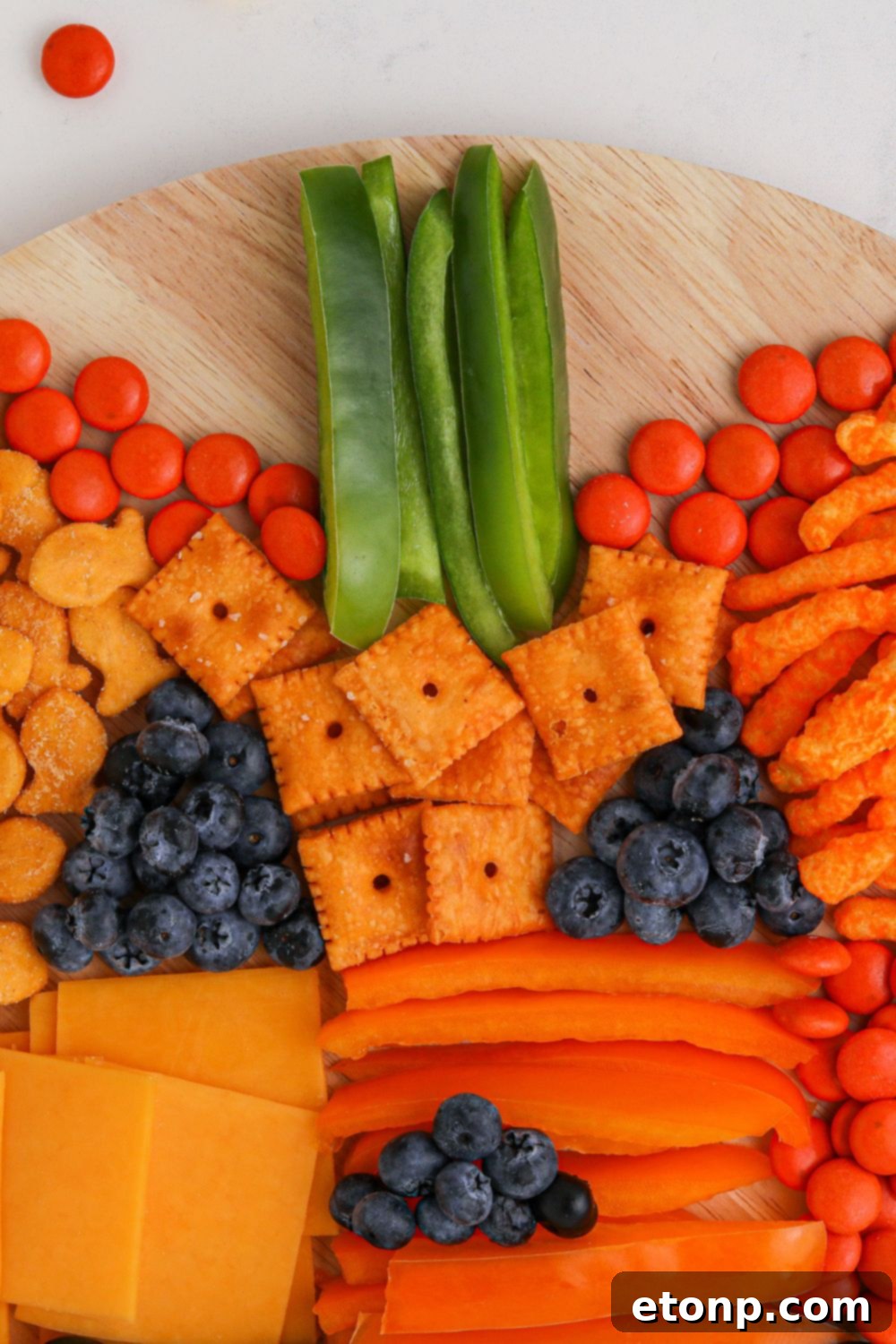Close-up of a pumpkin snack board highlighting the different textures and colors of snacks