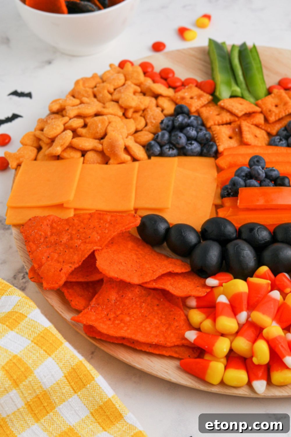 Side view of a pumpkin charcuterie board, showcasing its impressive arrangement on a table