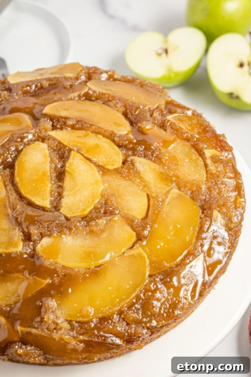side view of an upside down cake on a platter 