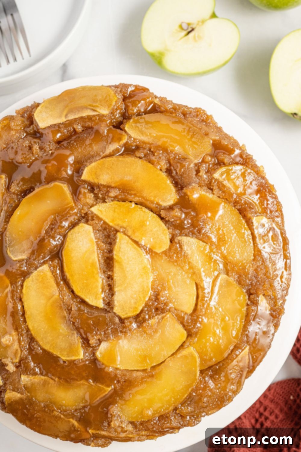 Apple Upside Down Cake on a platter on table 